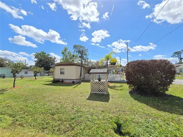 a house view with sitting space and garden