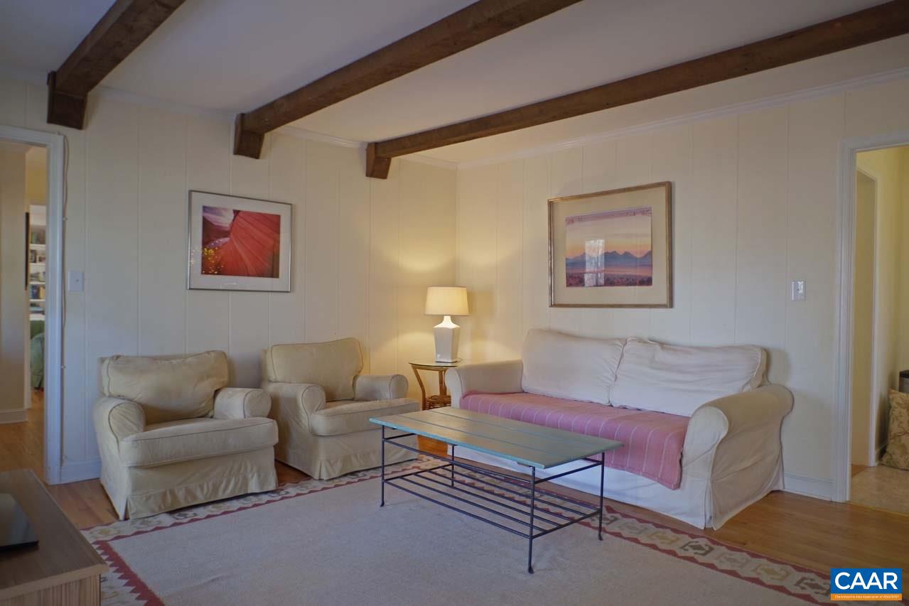 2657 Cardinal Ridge Road Charlottesville, VA 22901 - Photo 12 of 50 a living room with furniture and a night stand