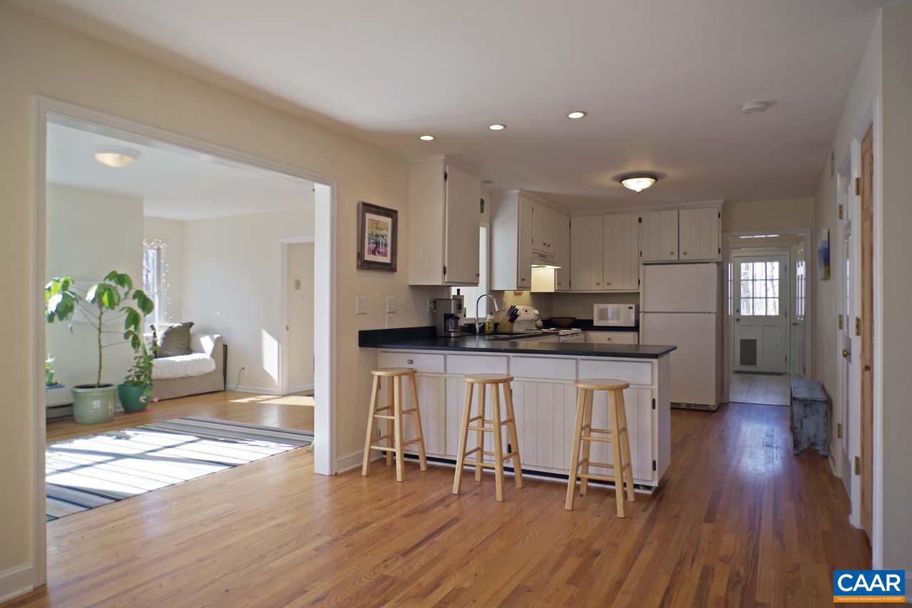 2657 Cardinal Ridge Road Charlottesville, VA 22901 - Photo 14 of 50 a kitchen with a table and chairs in it