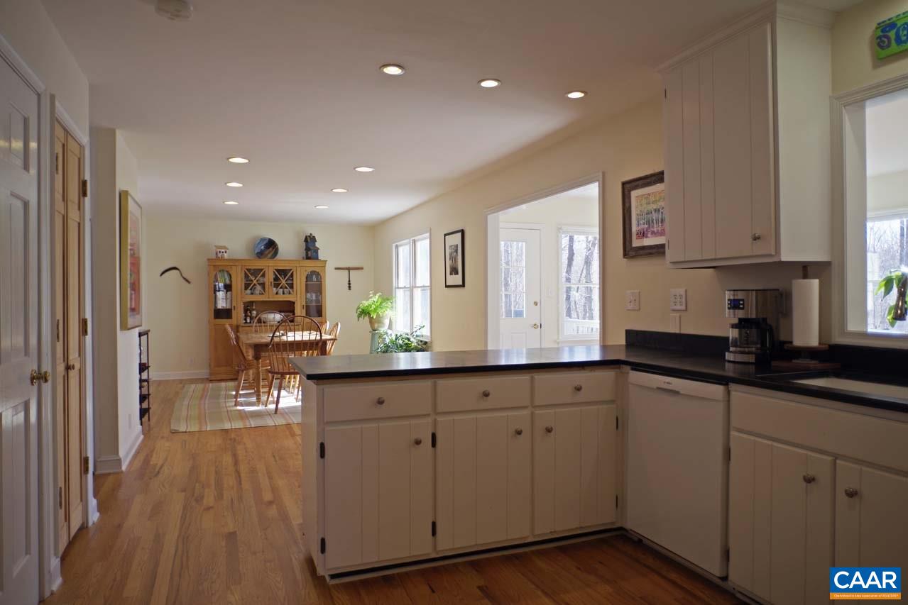 2657 Cardinal Ridge Road Charlottesville, VA 22901 - Photo 16 of 50 a kitchen with sink cabinets and wooden floor
