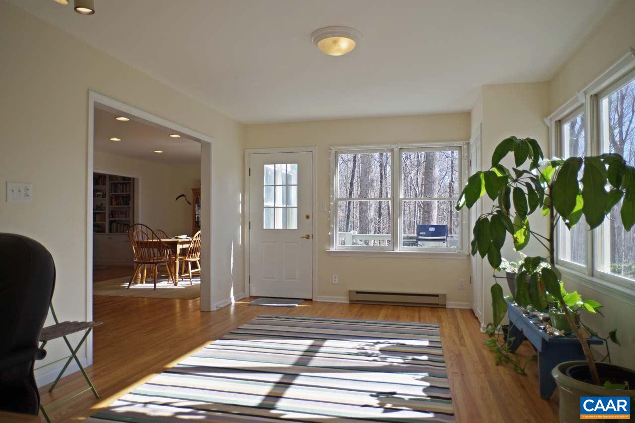 2657 Cardinal Ridge Road Charlottesville, VA 22901 - Photo 20 of 50 a living room with furniture and a potted plant