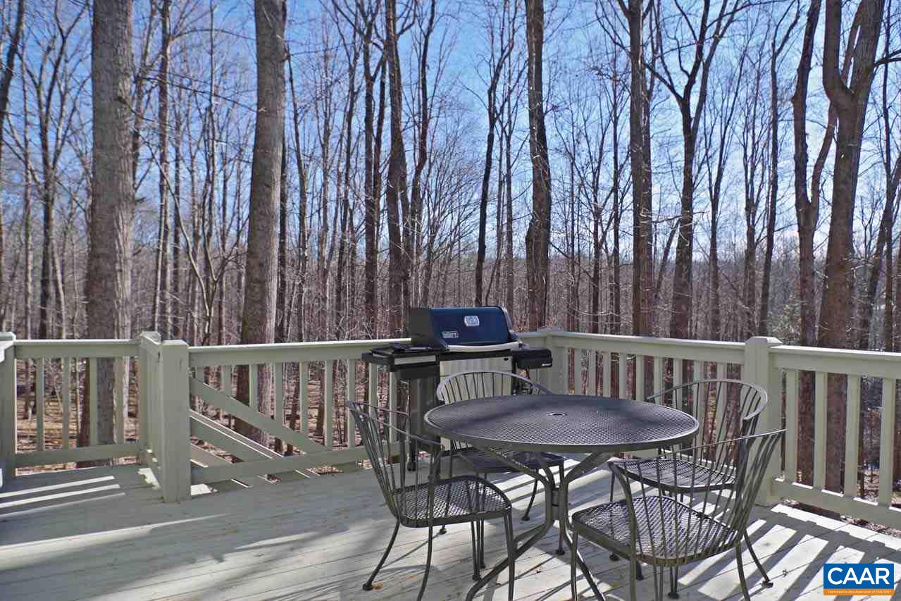 2657 Cardinal Ridge Road Charlottesville, VA 22901 - Photo 22 of 50 a view of a table and chairs in the balcony