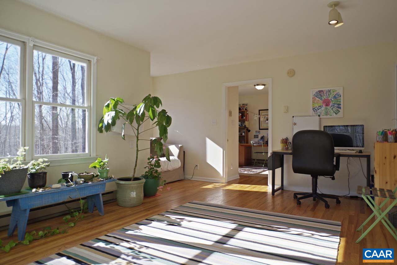 2657 Cardinal Ridge Road Charlottesville, VA 22901 - Photo 24 of 50 a living room with furniture and a floor to ceiling window