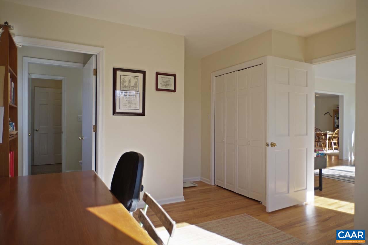 2657 Cardinal Ridge Road Charlottesville, VA 22901 - Photo 26 of 50 a view of a workspace room with wooden floor and furniture