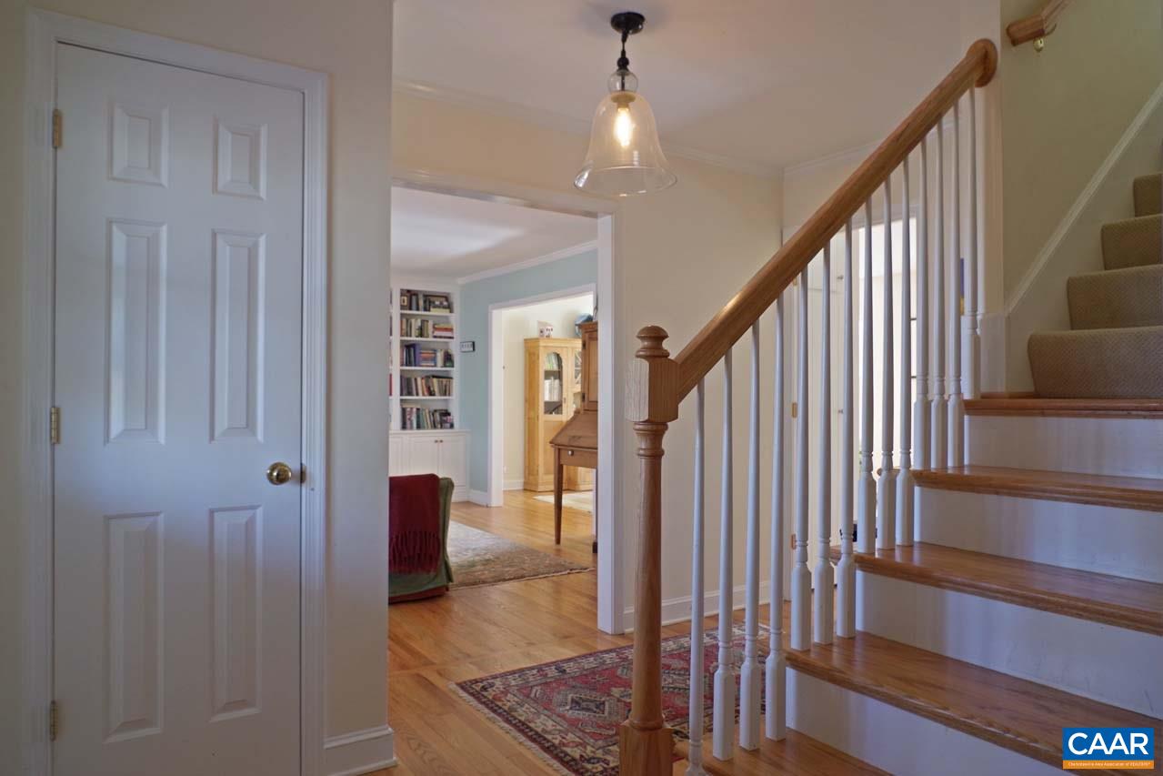 2657 Cardinal Ridge Road Charlottesville, VA 22901 - Photo 29 of 50 a view of a hallway with wooden floor and stairs