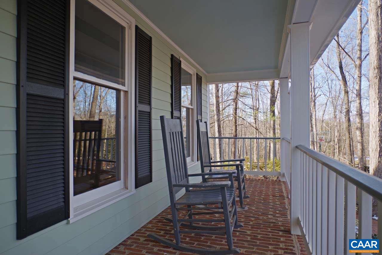 2657 Cardinal Ridge Road Charlottesville, VA 22901 - Photo 3 of 50 a view of a balcony with wooden floor and furniture