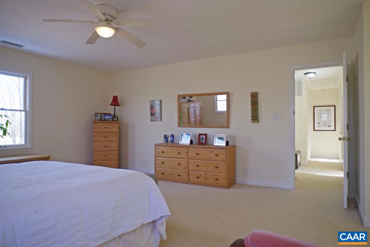 2657 Cardinal Ridge Road Charlottesville, VA 22901 - Photo 32 of 50 a bedroom with a bed and a dresser