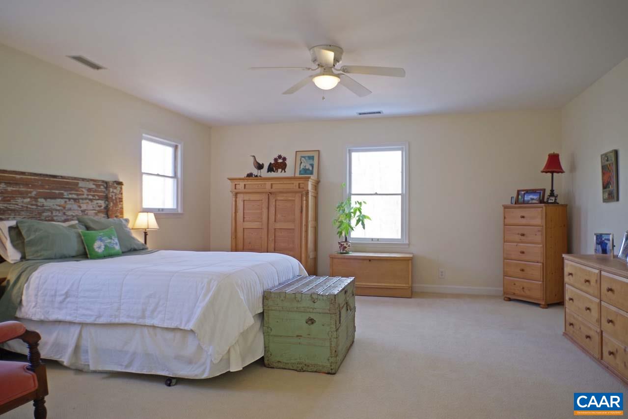 2657 Cardinal Ridge Road Charlottesville, VA 22901 - Photo 33 of 50 a bedroom with a bed and a dresser