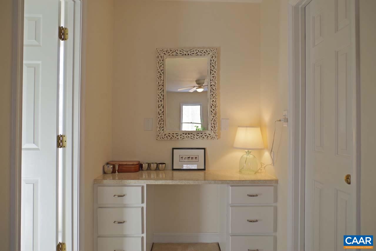 2657 Cardinal Ridge Road Charlottesville, VA 22901 - Photo 35 of 50 a bathroom with a sink and a mirror