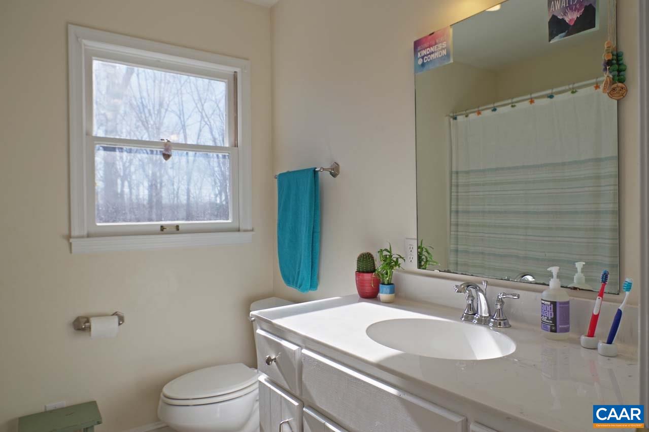 2657 Cardinal Ridge Road Charlottesville, VA 22901 - Photo 39 of 50 a bathroom with a sink toilet and mirror