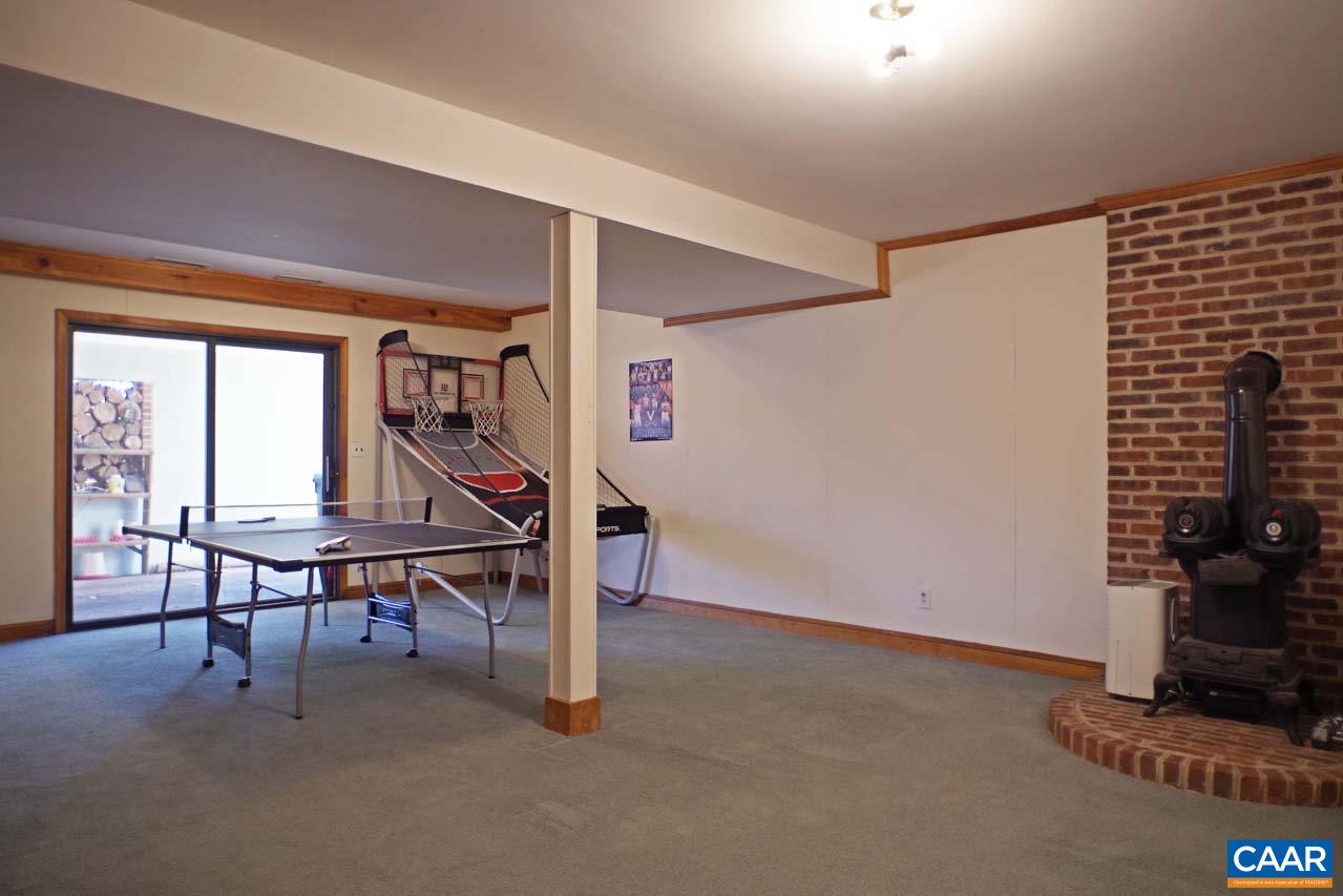 2657 Cardinal Ridge Road Charlottesville, VA 22901 - Photo 45 of 50 a view of a livingroom with furniture and a table