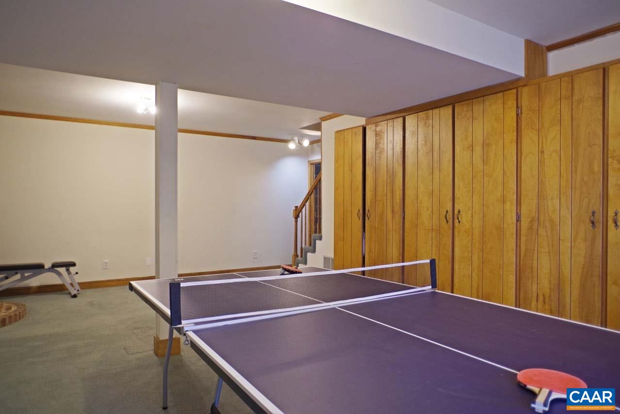 2657 Cardinal Ridge Road Charlottesville, VA 22901 - Photo 48 of 50 a room with a table and a mirror