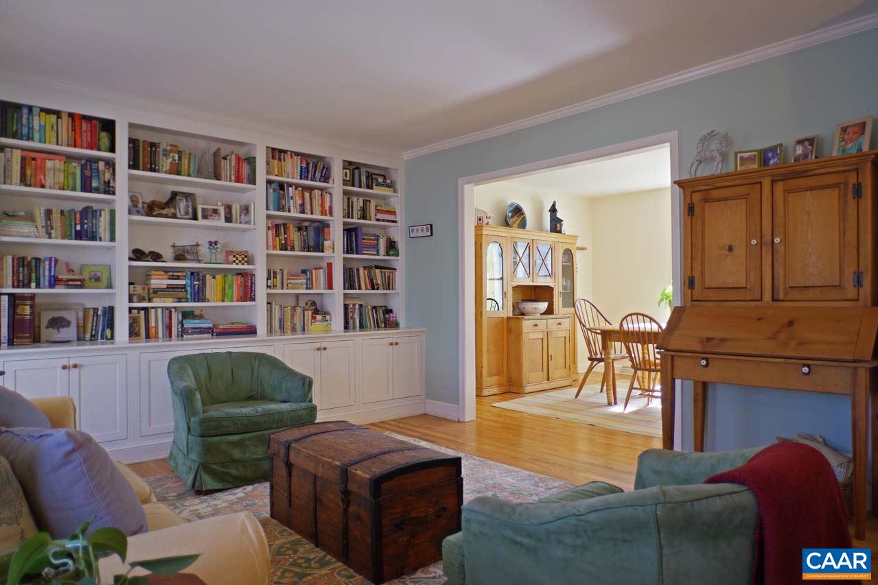 2657 Cardinal Ridge Road Charlottesville, VA 22901 - Photo 9 of 50 a living room with furniture and a book shelf