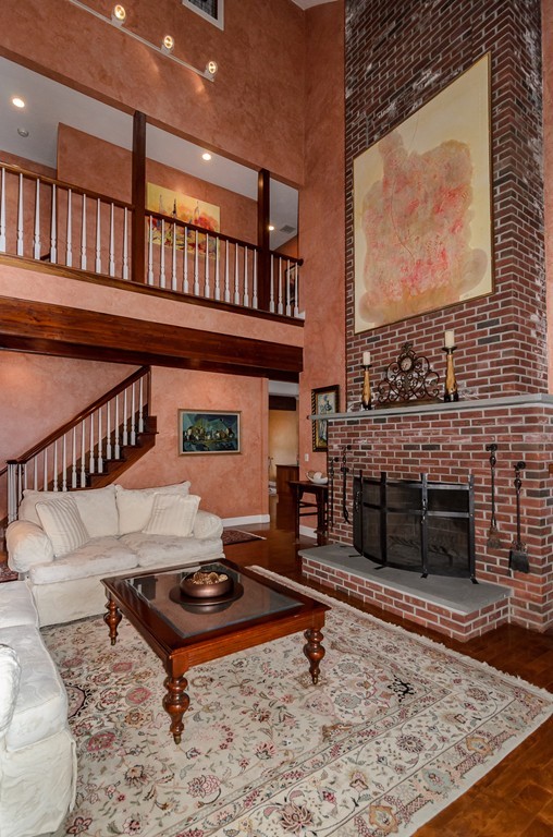 5 Wareland Road Wellesley, MA 02481 - Photo 3 of 19 a living room with furniture a rug and a fireplace