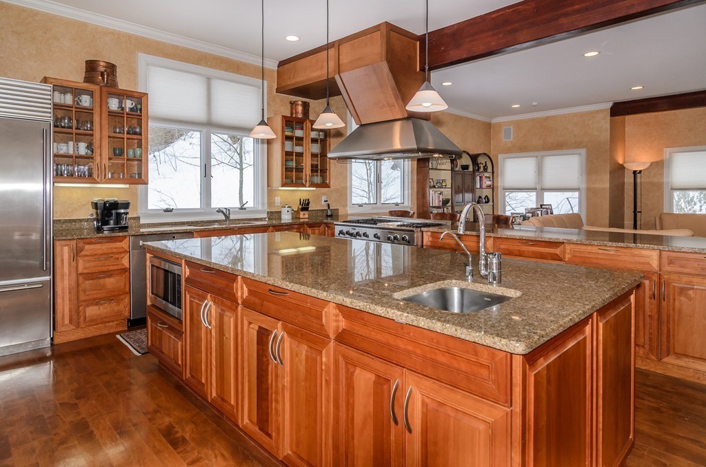 5 Wareland Road Wellesley, MA 02481 - Photo 8 of 19 a kitchen with stainless steel appliances granite countertop a sink a stove and a wooden cabinets