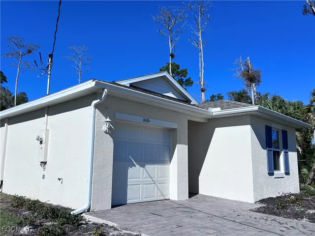 a view of a house with a garage