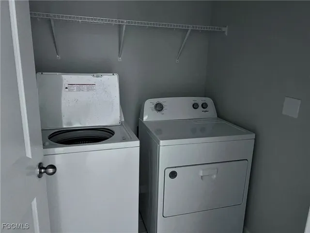 a utility room with dryer and washer