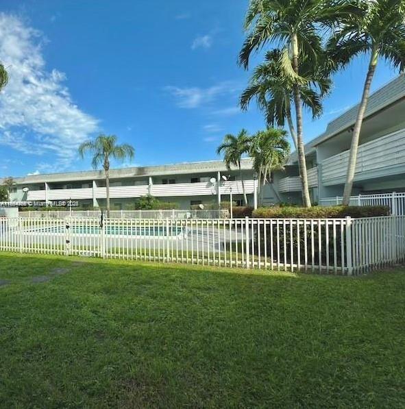 4251 Northwest 5th Street, Unit 239 Plantation, FL 33317 - Photo 3 of 4 a view of a garden and deck