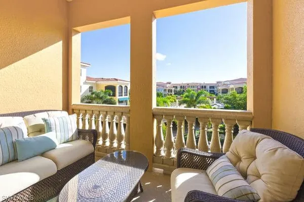 a balcony with furniture and a couch