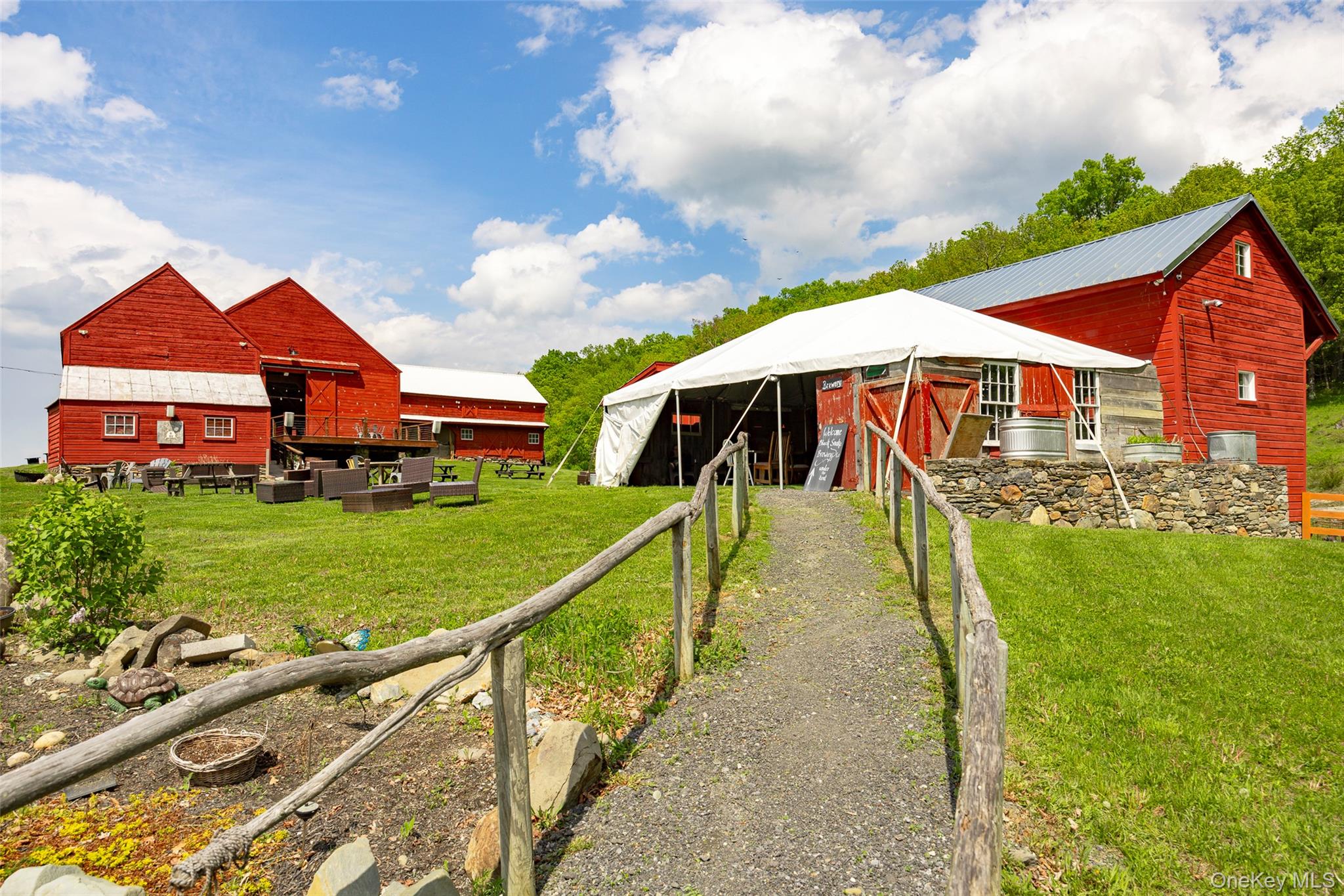 148 Creek Road Staatsburg, NY 12580 - Photo 14 of 27 Back of property with a pole building, an outbuilding, and metal roof