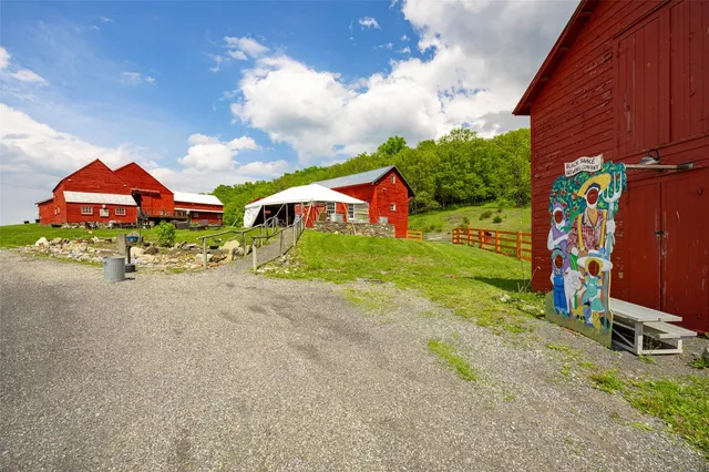 a view of a building with a yard