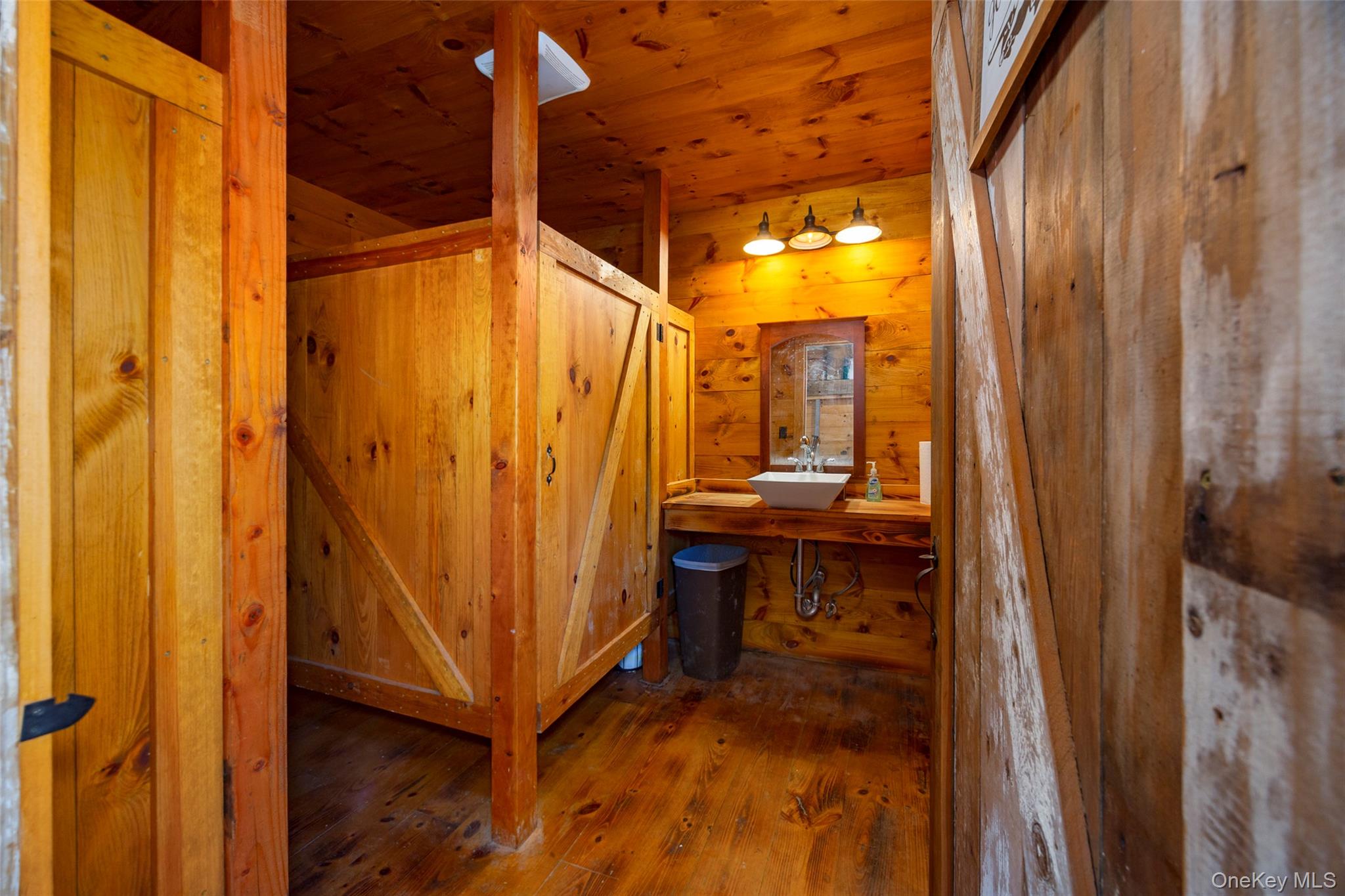 148 Creek Road Staatsburg, NY 12580 - Photo 25 of 27 Bathroom with wood ceiling, wood finished floors, wood walls, and a sink