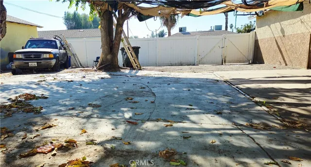 a view of a backyard of the house