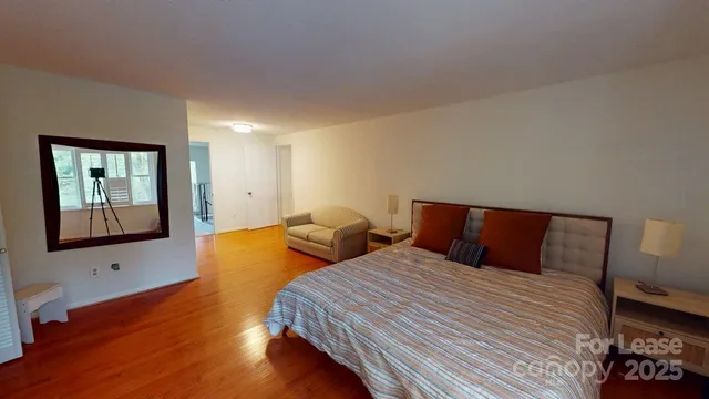 a bedroom with double bed and a window