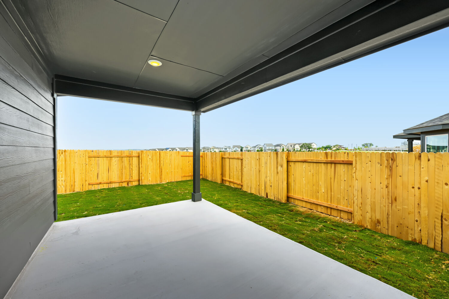 146 Diablo Rim Terrace Dripping Springs, TX 78620 - Photo 27 of 32 A spacious covered patio provides an ideal setting for outdoor entertaining, enclosed by a privacy fence.