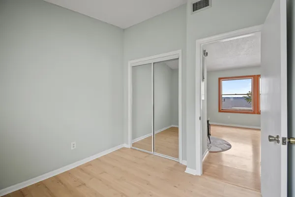 a view of a livingroom with furniture and a window