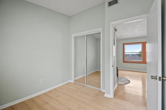 a view of a livingroom with furniture and a window