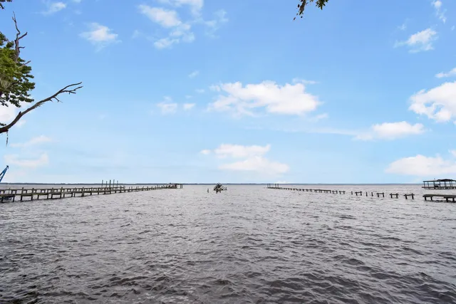 a view of an empty room and wooden floor