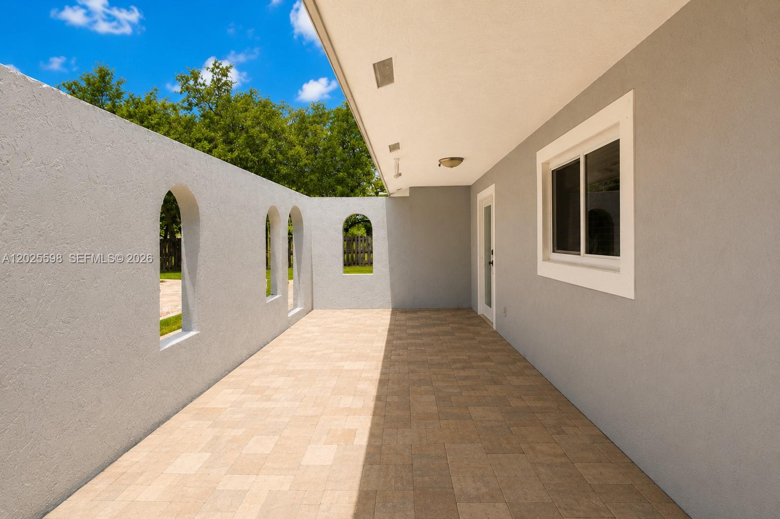 9421 Southwest 150th Street Miami, FL 33176 - Photo 4 of 31 a view of an entryway of the house