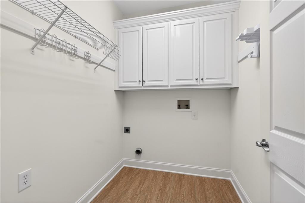 226 Hames Road, Unit 140 Woodstock, GA 30188 - Photo 15 of 32 a view of walk in closet with empty racks