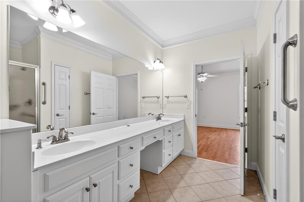 226 Hames Road, Unit 140 Woodstock, GA 30188 - Photo 18 of 32 a bathroom with a double vanity sink mirror and double