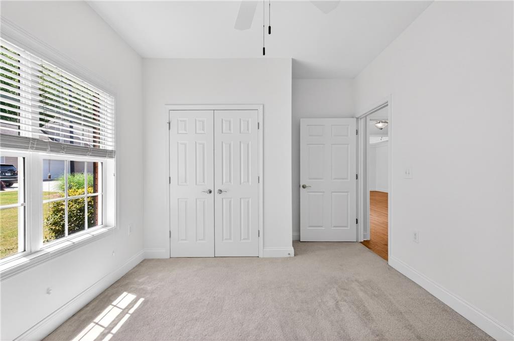 226 Hames Road, Unit 140 Woodstock, GA 30188 - Photo 21 of 32 a view of an empty room with a window