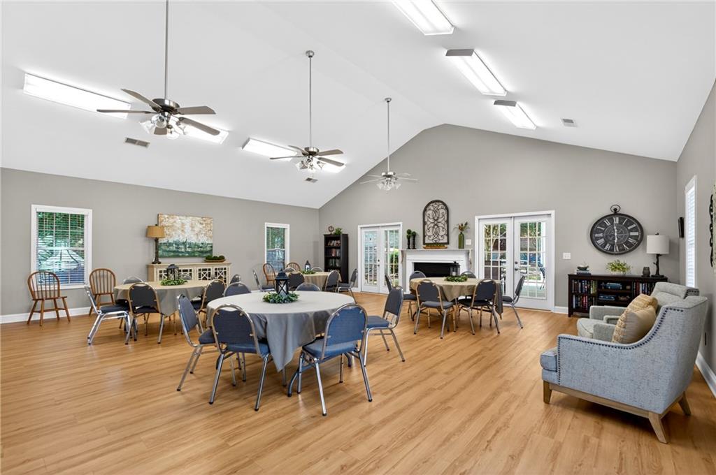 226 Hames Road, Unit 140 Woodstock, GA 30188 - Photo 29 of 32 a view of a dining room with furniture window and wooden floor
