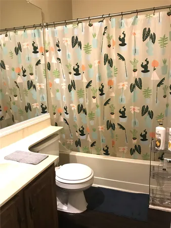 a room with wooden floor and a window