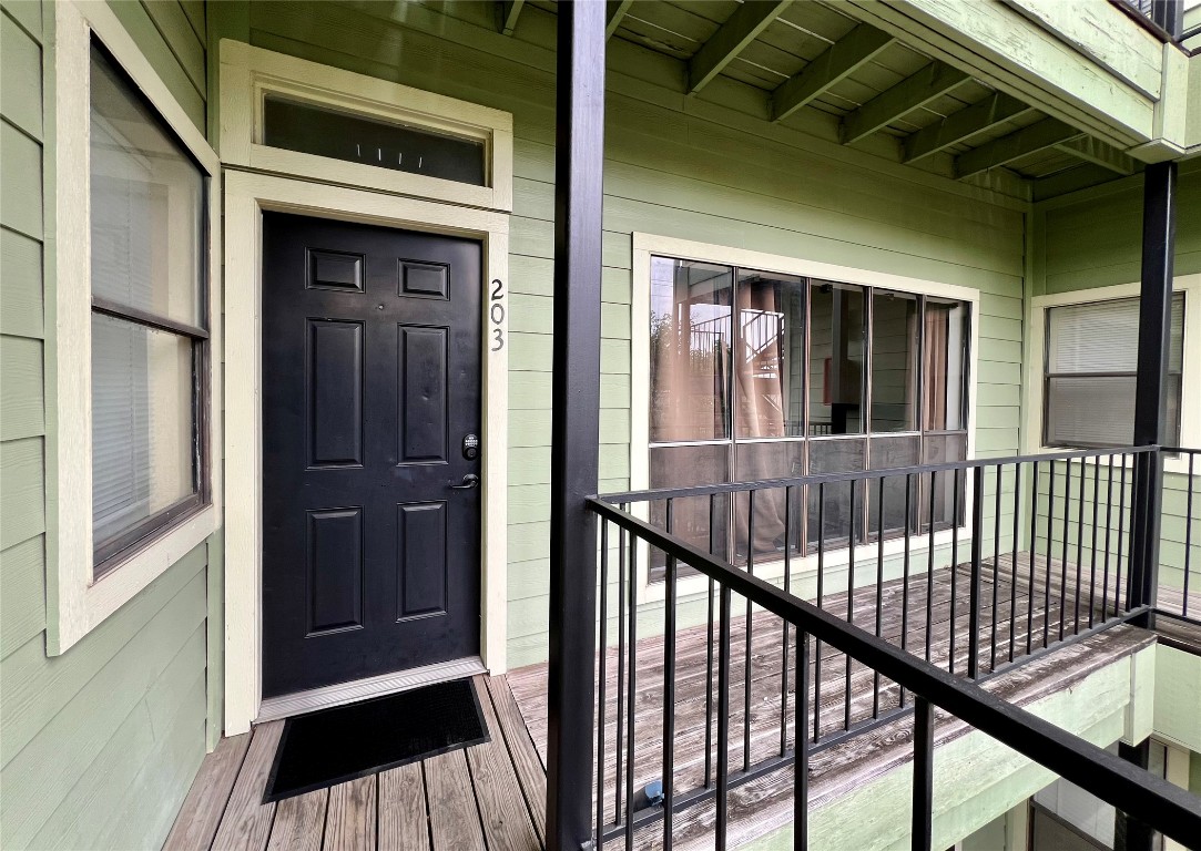 915 West 22nd 1/2 Street, Unit 203 Austin, TX 78721 - Photo 2 of 12 a view of a balcony with a staircase