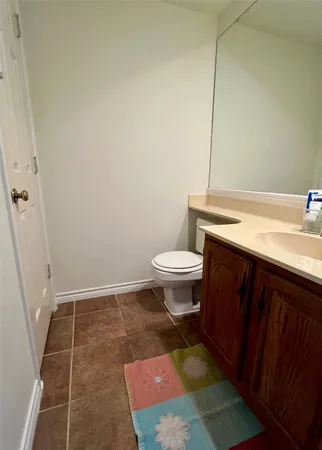 a kitchen with a sink window and cabinets