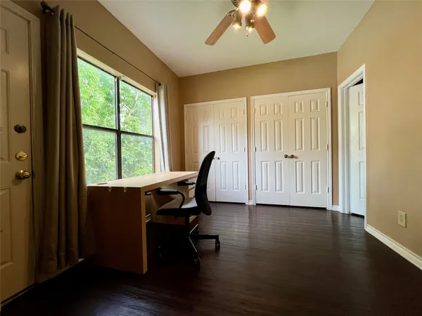 a bathroom with a toilet and a bathtub