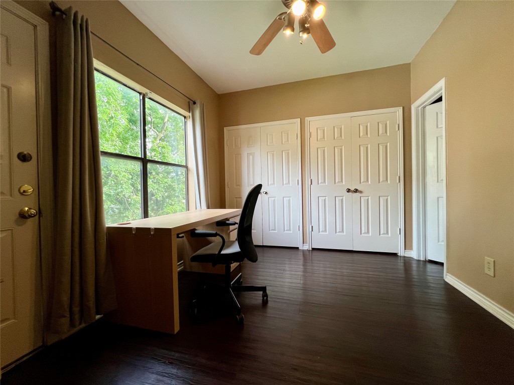 915 West 22nd 1/2 Street, Unit 203 Austin, TX 78721 - Photo 10 of 12 a view of a workspace with furniture and a window