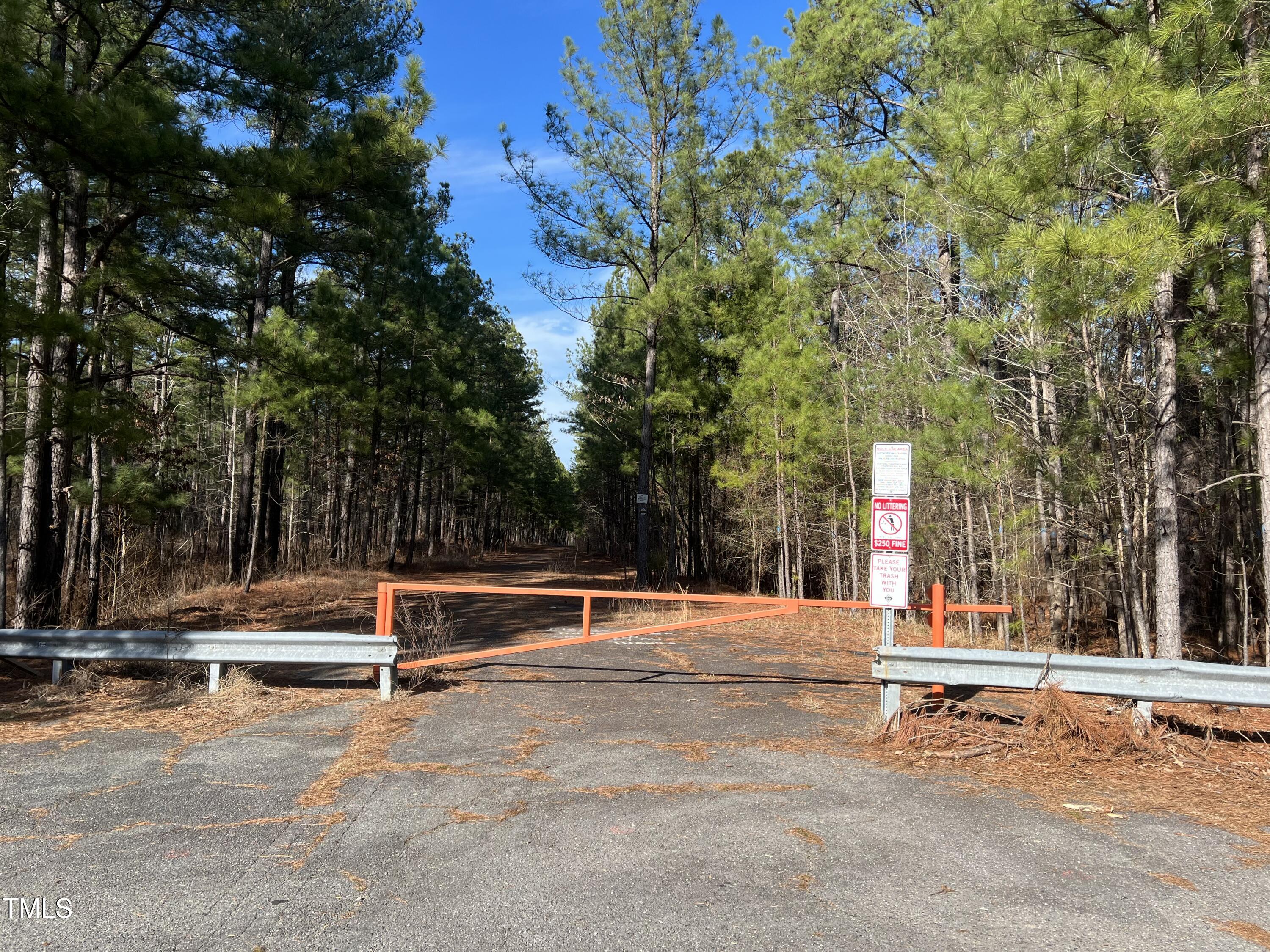 100 Anfield Road New Hill, NC 27562 - Photo 14 of 17 a backyard of a house with trees and outdoor seating