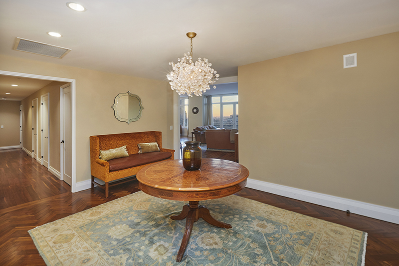 2150 Broadway, Unit PH2B Manhattan, NY 10023 - Photo 20 of 35 a living room with dining table and a mirror