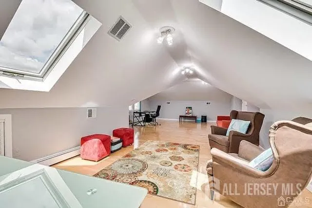 a bedroom with furniture and a chandelier