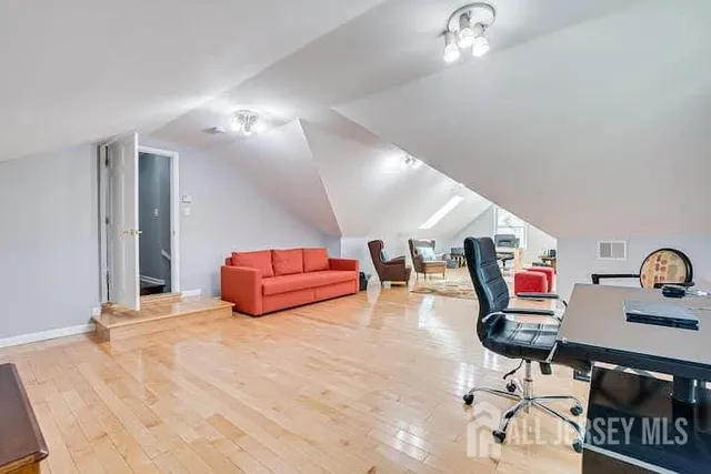 a bedroom with furniture and a chandelier