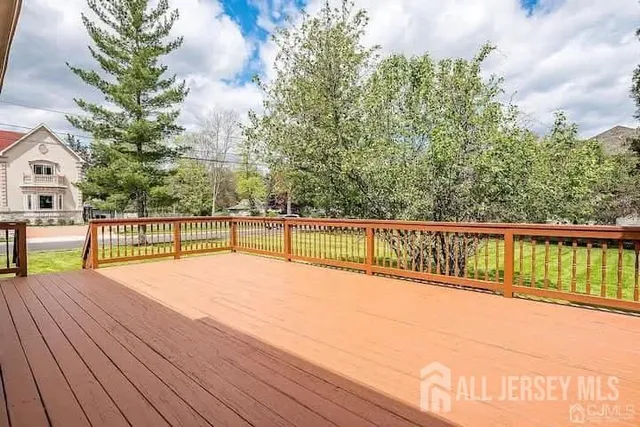 a view of balcony with wooden floor