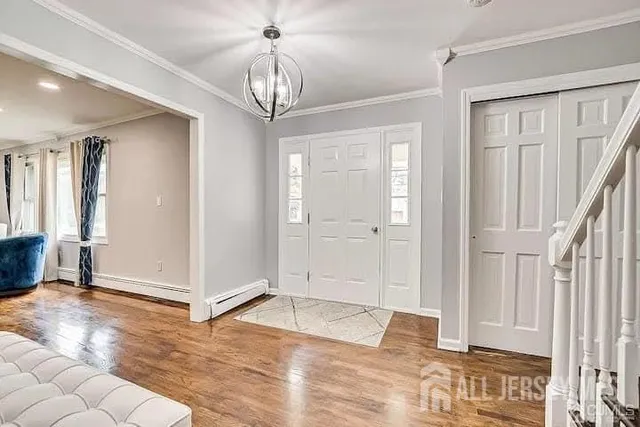 a view of a chandelier in a room with stairs and a chandelier