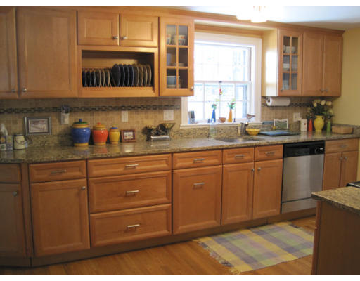 27 Crown Ridge Road Wellesley, MA 02482 - Photo 4 of 9 a kitchen with stainless steel appliances granite countertop cabinets and window