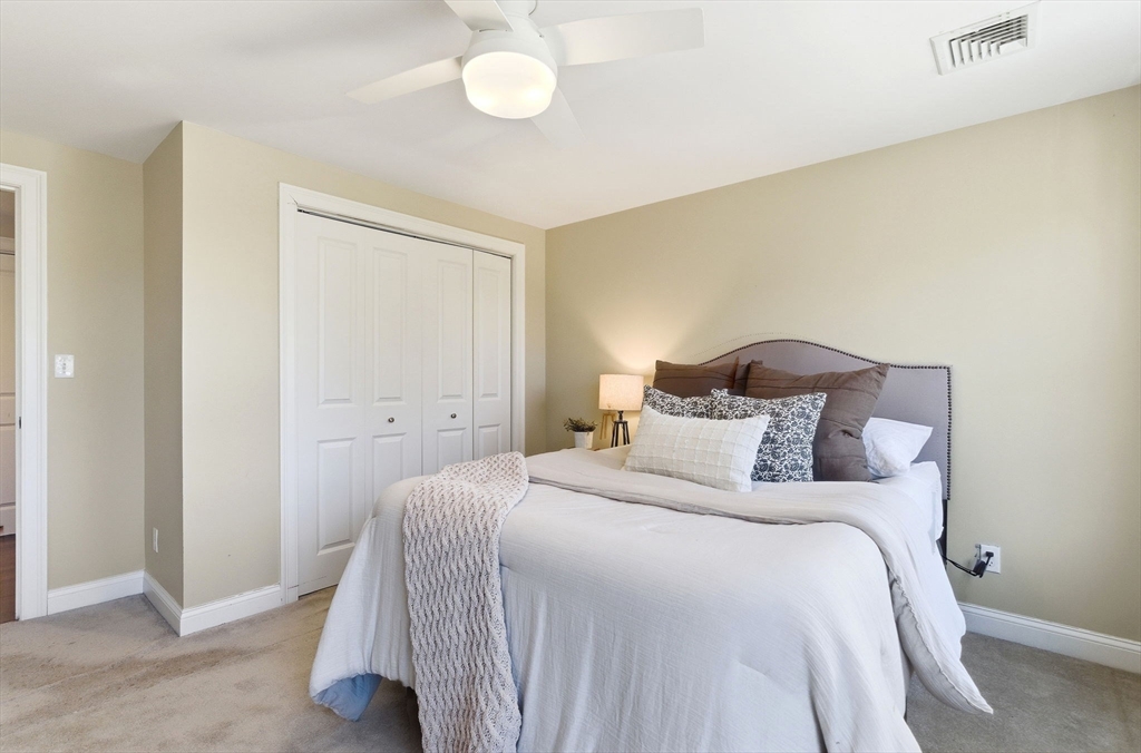 70 Great Road, Unit G Bedford, MA 01730 - Photo 11 of 15 a bedroom with a bed and a window